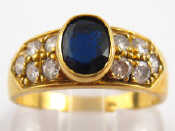 Appraisal: A yellow metal tests carat gold sapphire and diamond ring