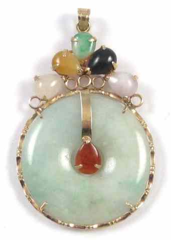 Appraisal: CHINESE JADE AND FOURTEEN KARAT GOLD PENDANT set with a