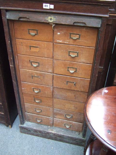 Appraisal: An early th century oak tambour fronted filing cabinet with