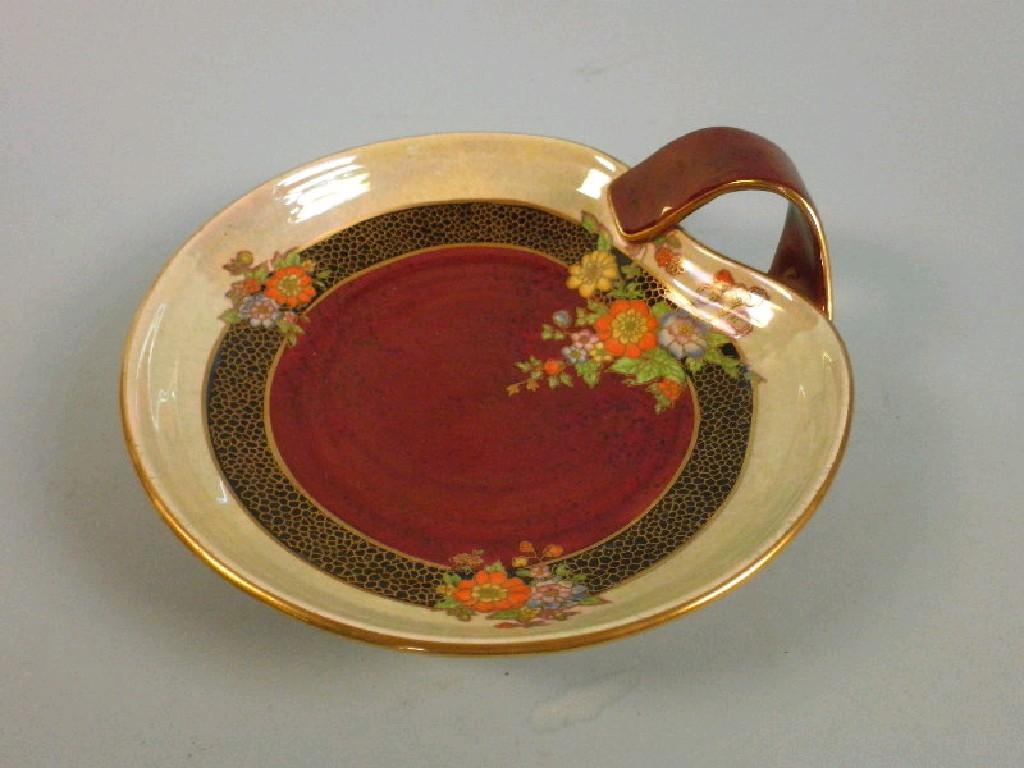 Appraisal: A Crown Devon heart-shaped dish decorated in lustre glazes with