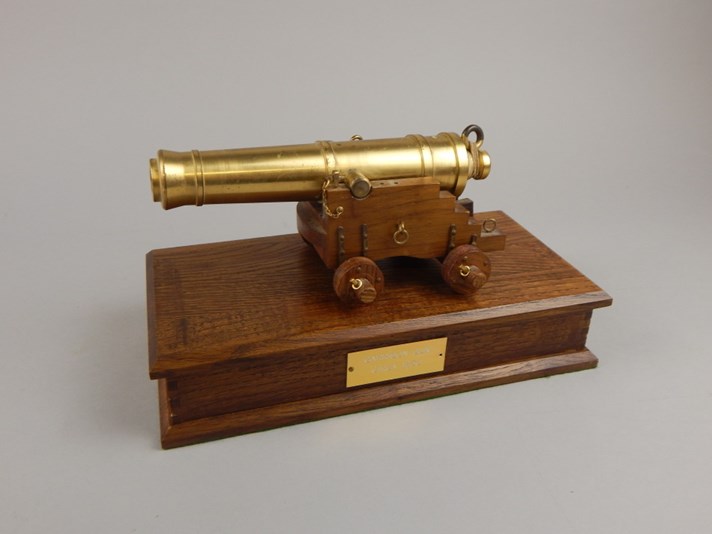 Appraisal: A thC brass table cannon and Garrison gun the cylindrical