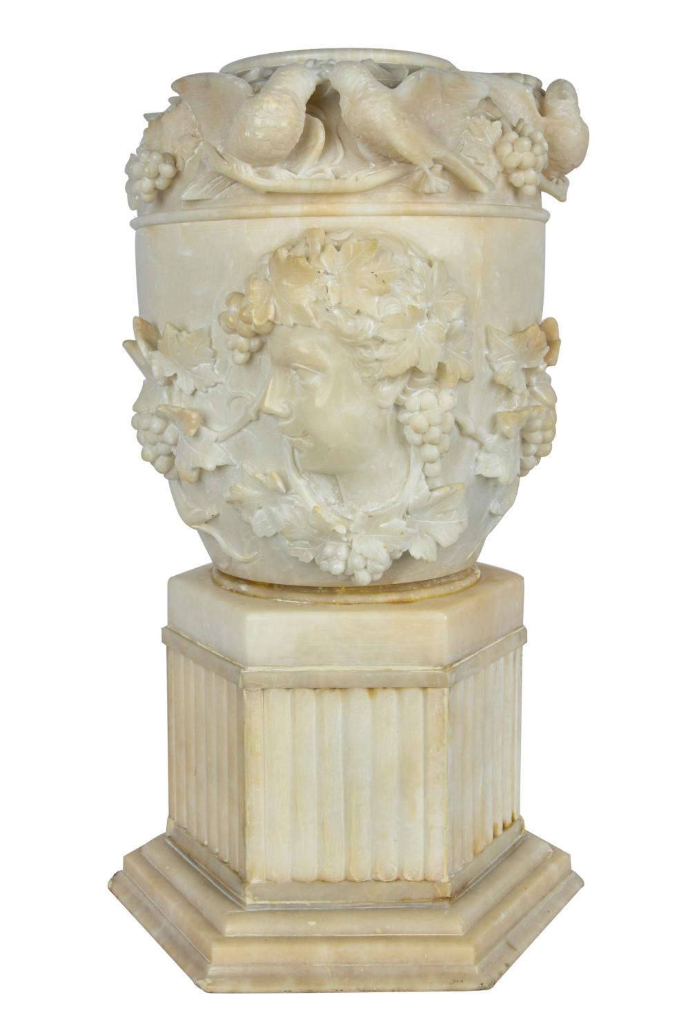 Appraisal: ALABASTER URN ON PEDESTALwith bird and fruit motif Condition looks