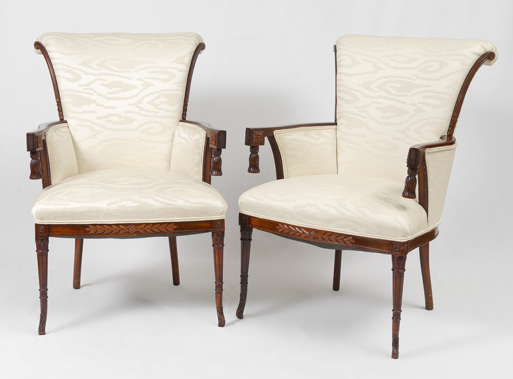 Appraisal: PAIR CARVED FRENCH STYLE CHAIRS Carved frames with unique tassels