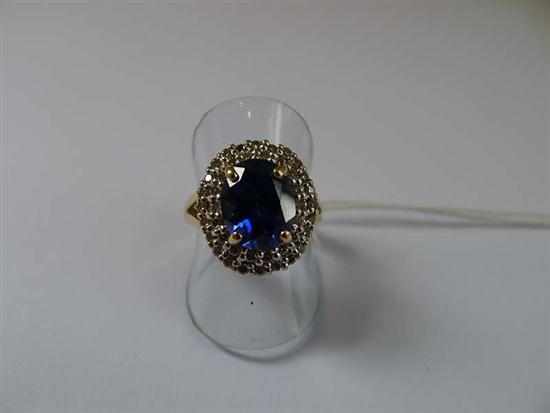 Appraisal: A SYNTHETIC SAPPHIRE AND DIAMOND CLUSTER RING STAMPED CT GOLD