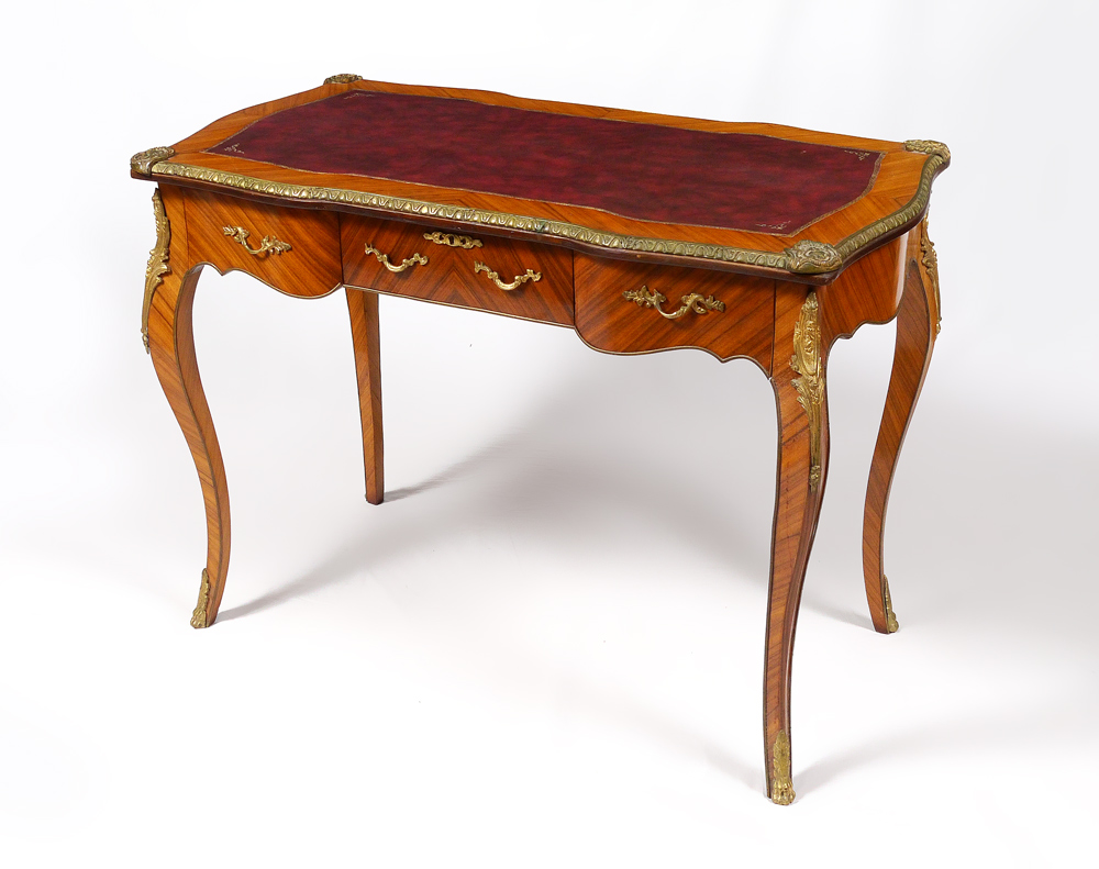 Appraisal: ORMOLU MOUNTED FRENCH WRITING DESK Shaped top inset leather writing