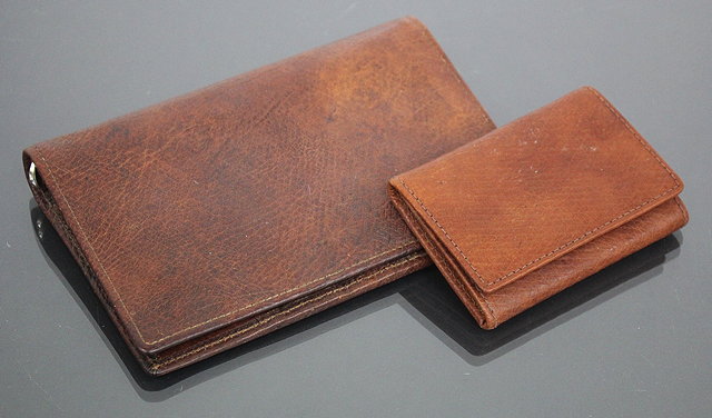 Appraisal: A POCKET ORGANISER and card holder made from two hundred