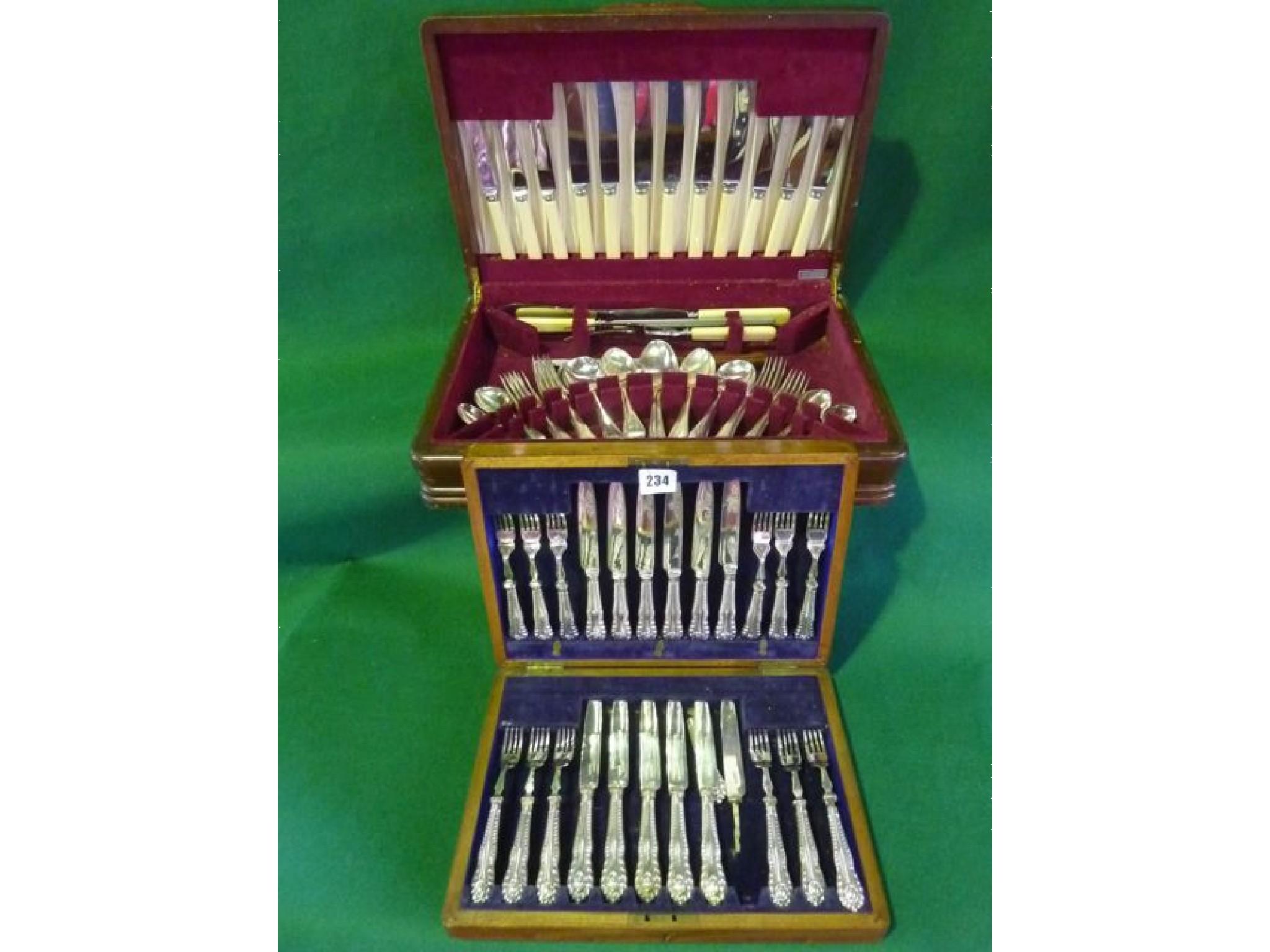 Appraisal: A cased half canteen of cutlery together with a cased