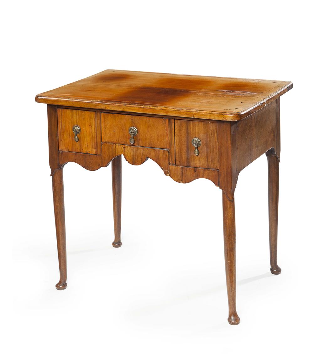 Appraisal: WALNUT LOWBOY TH CENTURY AND LATER the crossbanded rounded rectangular