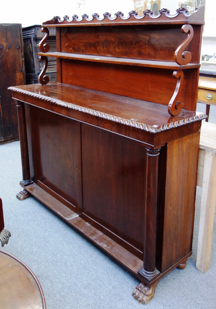 Appraisal: A th century mahogany side cabinet the double shelf back