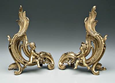 Appraisal: Pair brass chenet with putti rococo style heavy cast brass