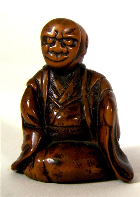 Appraisal: A Japanese carved wood netsuke Meiji period in the form