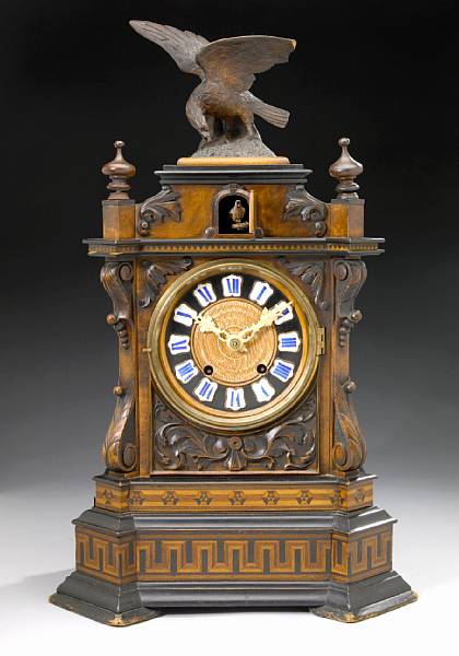 Appraisal: A Bavarian carved walnut musical cuckoo mantel clock fourth quarter