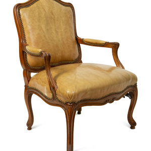 Appraisal: A French Provincial Style Leather Upholstered Fauteuil TH CENTURY Height