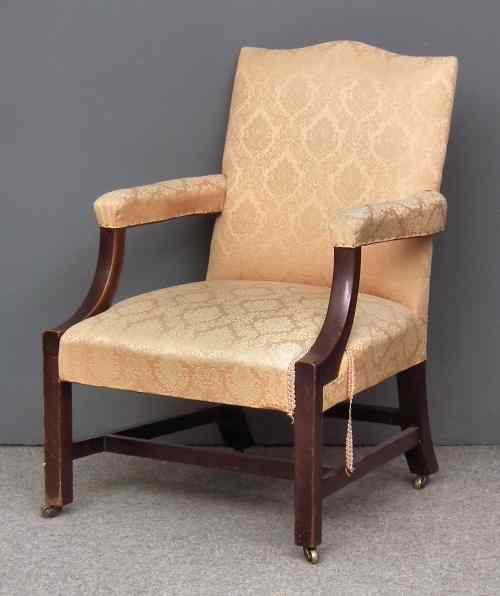 Appraisal: A mahogany open armchair of Georgian design with shaped crest