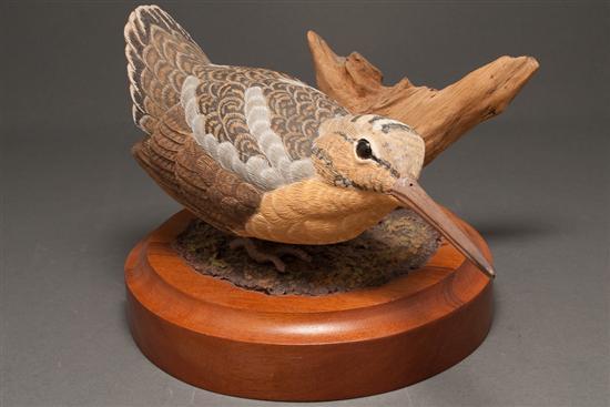 Appraisal: Carved and painted woodcock mounted on turned wood base bird