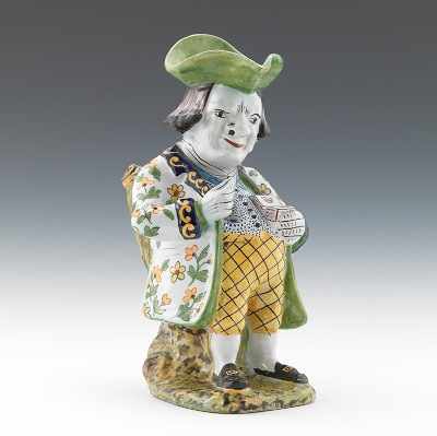 Appraisal: A Faience Snuff Taker Shaped Pitcher Hand decorated in blues