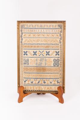 Appraisal: A needlework sampler with text and alphabet etc by Joan