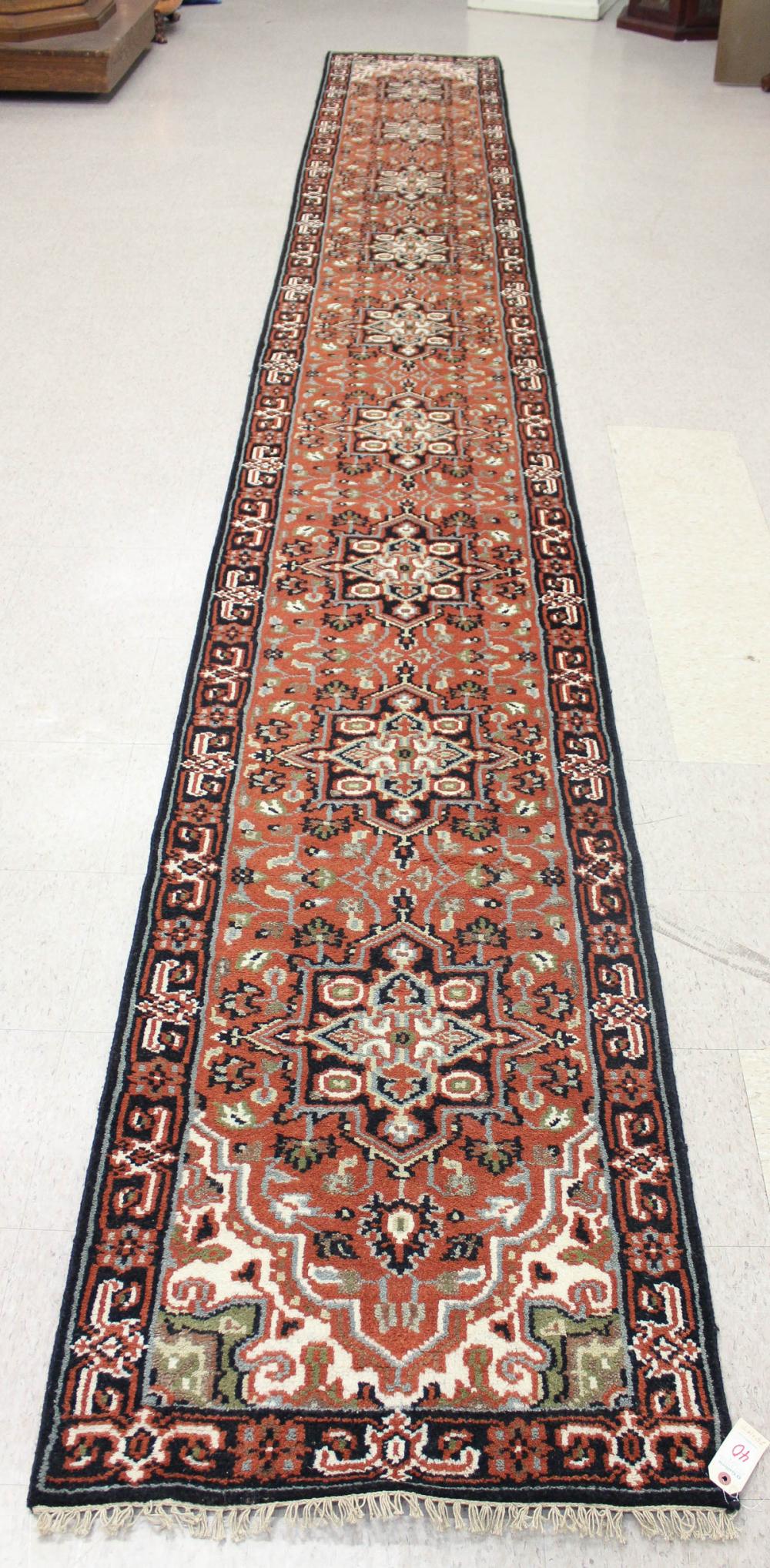 Appraisal: HAND KNOTTED ORIENTAL CORRIDOR RUG Indo-Persian repeating medallions and overall