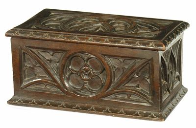 Appraisal: A carved and stained wood boarded box in Gothic taste