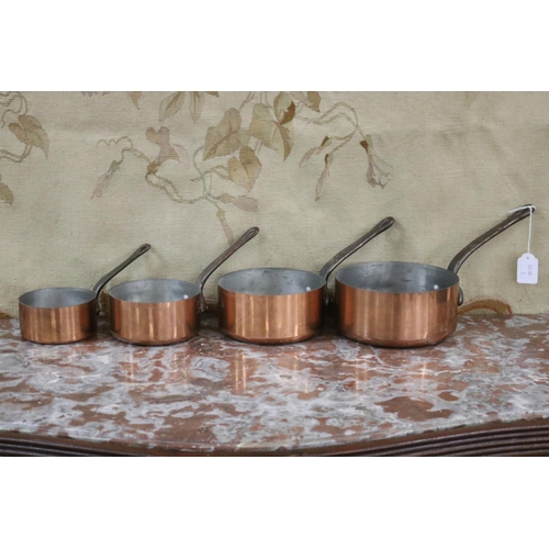 Appraisal: Set of four French copper wrought iron saucepans approx cm