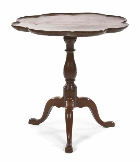 Appraisal: A Georgian Mahogany Tilt-Top Tea Table having a lobed circular