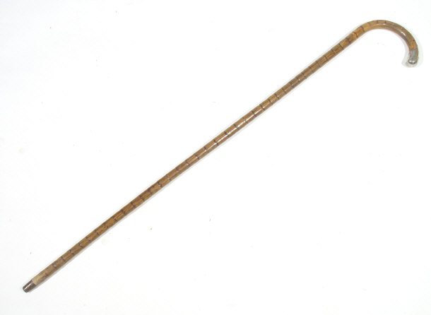 Appraisal: Simulated bamboo walking stick with silver mount to the handle