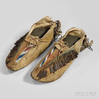 Appraisal: Apache Man's Moccasins c with rawhide soles heel fringe and