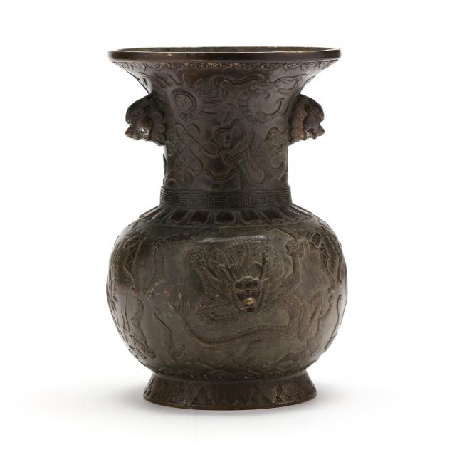 Appraisal: A CHINESE BRONZE VASE WITH FRONTAL FACING DRAGON th century