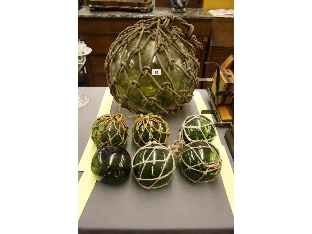 Appraisal: Large green glass witch's ball within rope surround diameter approx