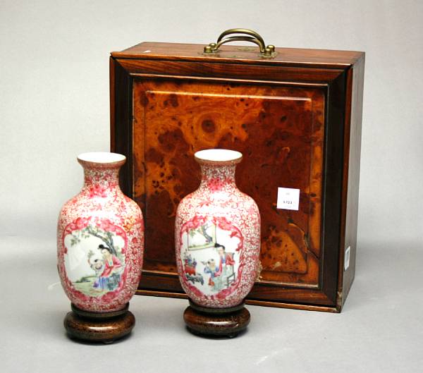 Appraisal: A pair of ruby red and polychrome enameled eggshell porcelain