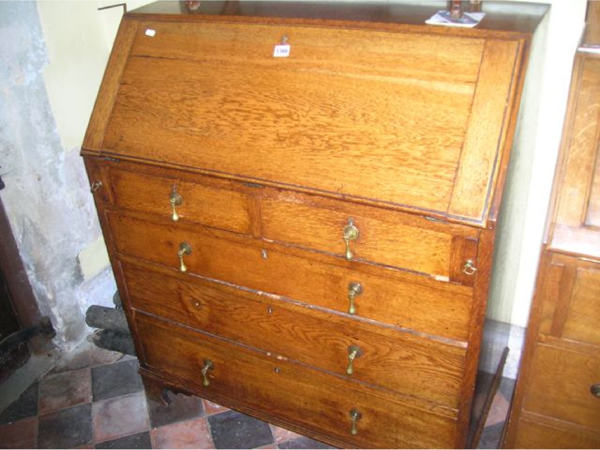 Appraisal: A late th century oak bureau of three long and