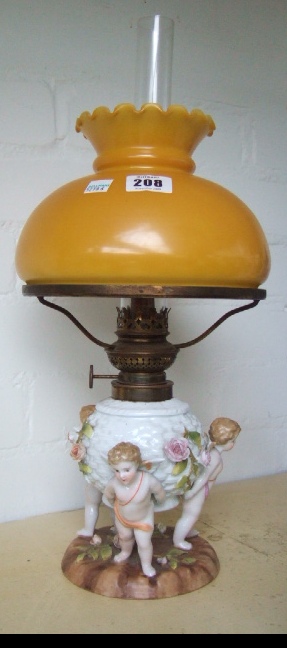 Appraisal: A Plau porcelain oil lamp base moulded with three cherubic