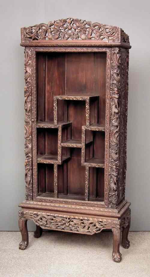 Appraisal: An early th Century Chinese blackwood display cabinet the whole