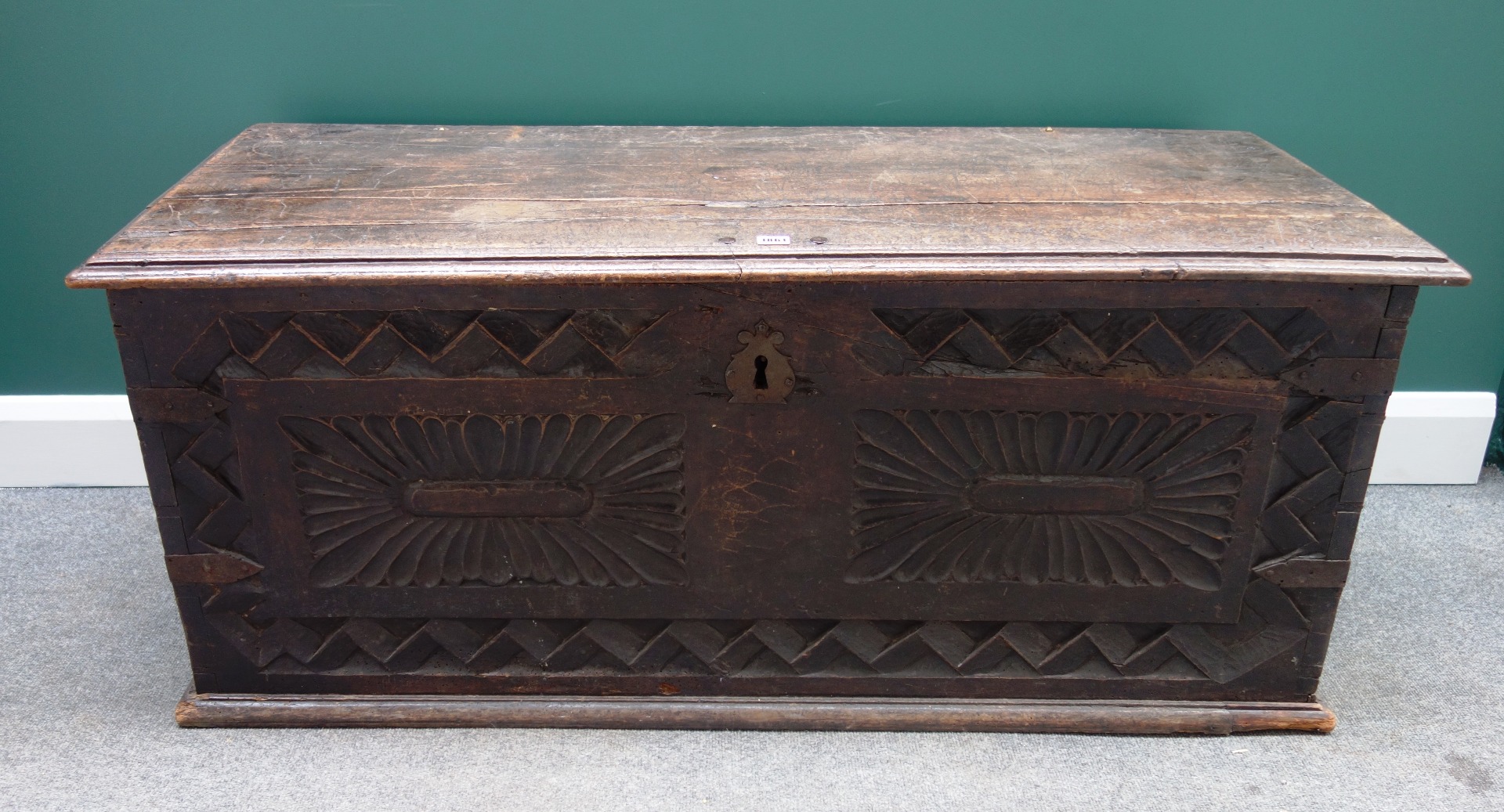 Appraisal: A late th century Continental walnut coffer with carved front