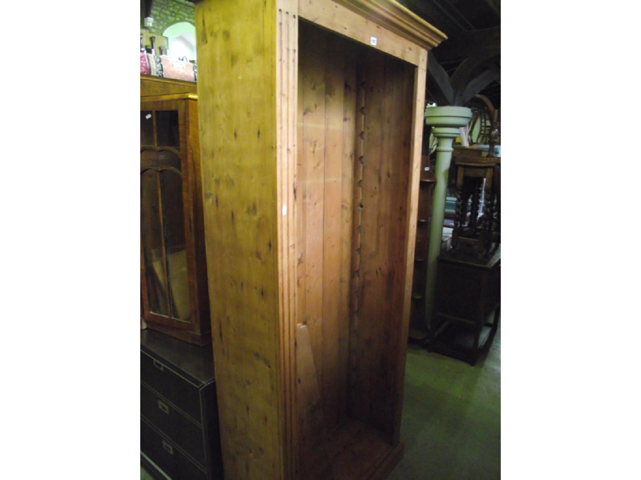 Appraisal: An open bookcase in stripped and waxed pine of full