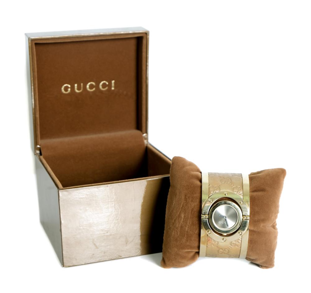 Appraisal: GUCCI TWIRL SILVER DIAL GOLD-TONE STEEL BRACELETGucci gold-tone stainless steel