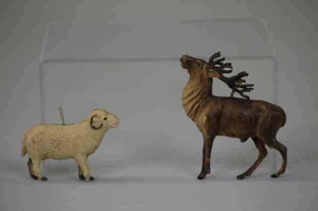 Appraisal: DRESDEN REINDEER AND RAM ORNAMENTS Germany reindeer with red tongue