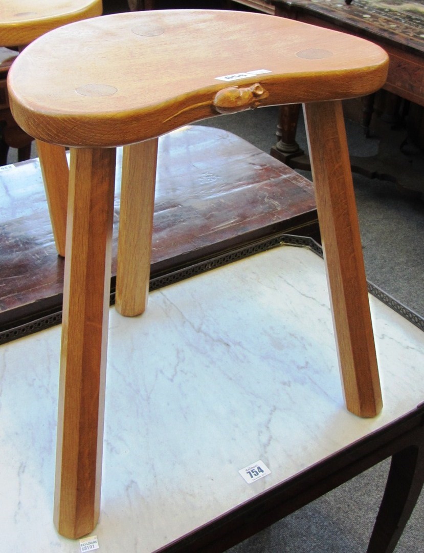 Appraisal: A Robert 'Mouseman' Thompson oak stool with dished kidney shaped