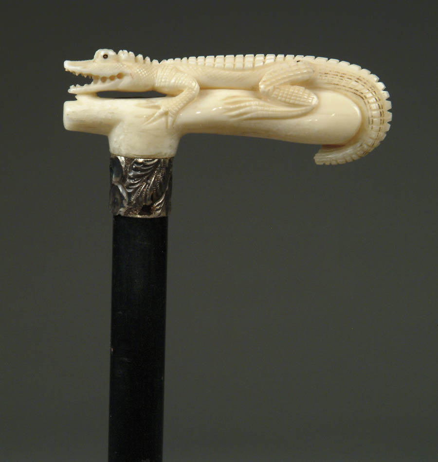 Appraisal: CARVED IVORY ALLIGATOR CANE L-shaped handle has a carved alligator