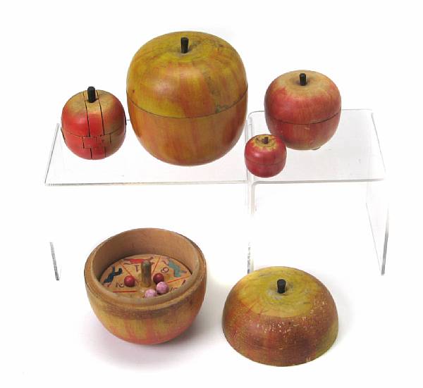 Appraisal: A group of four turned wood apple form lidded boxes