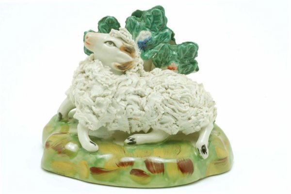 Appraisal: Staffordshire type resting ram with coleslaw decorated body against a