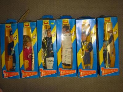 Appraisal: Six Pelham Thunderbirds puppets blue and yellow window boxes G