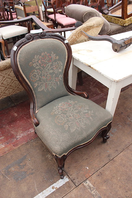 Appraisal: A VICTORIAN OCCASIONAL CHAIR with shaped back overstuffed upholstered serpentine