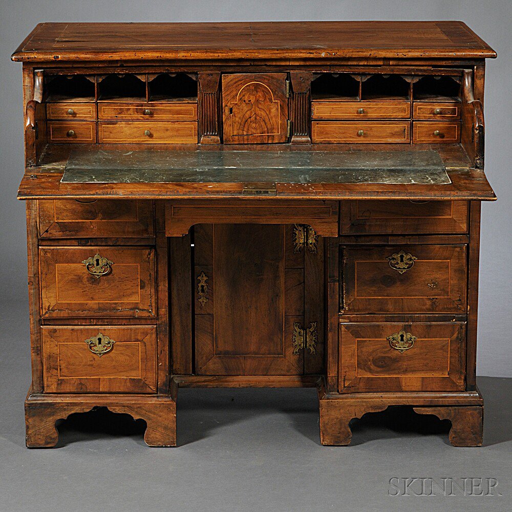 Appraisal: George III Walnut-veneered Kneehole Desk early th century crossbanded throughout