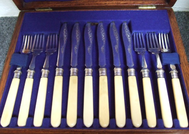 Appraisal: Twelve pairs of plated dessert or fruit knives and forks