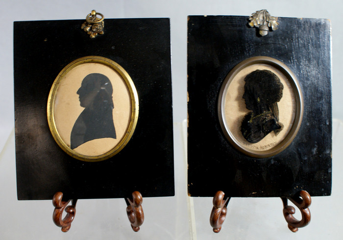 Appraisal: oval silhouettes Perdita Robinson reverse painted on convex glass man