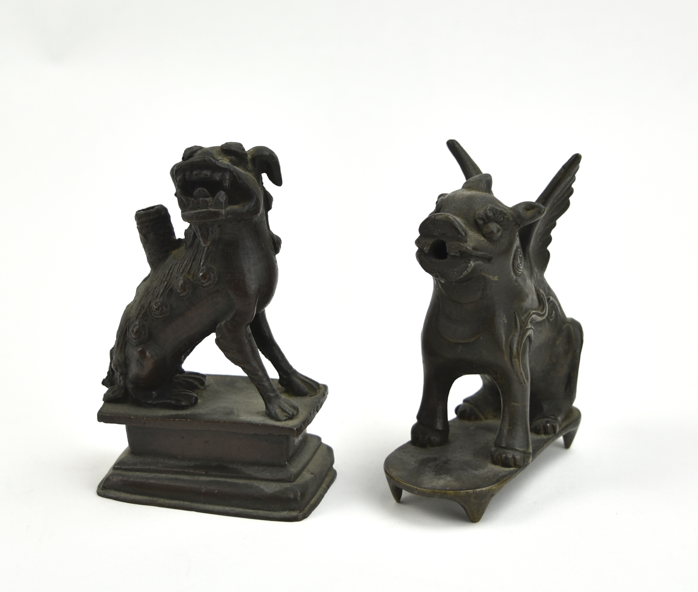 Appraisal: Chinese Qing Dynasty each modeled with a seated foo dog