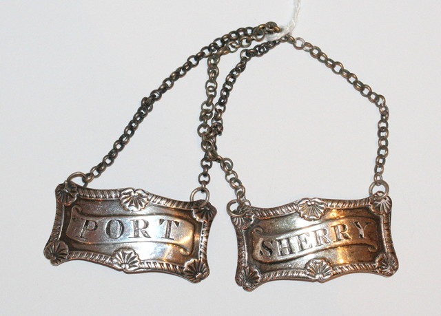 Appraisal: A PAIR OF SCOTTISH SILVER DECANTER LABELS rectangular shaped with