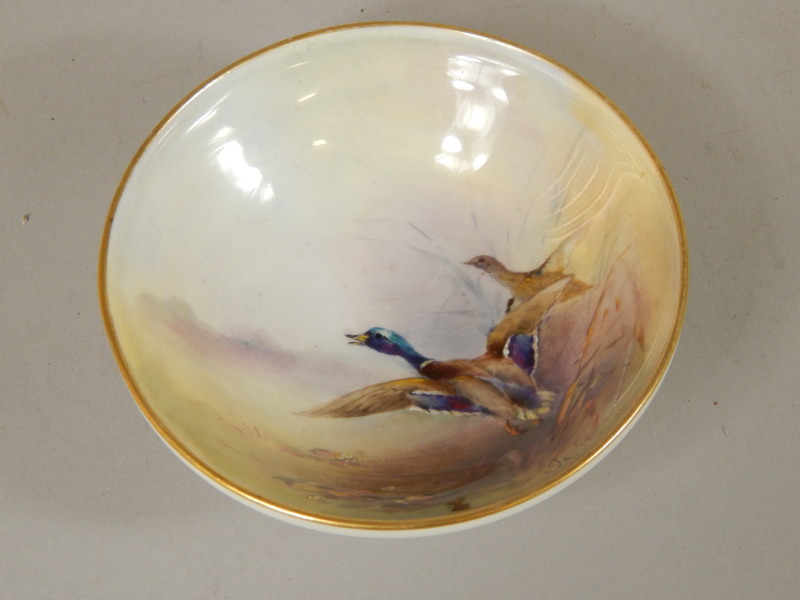 Appraisal: A Royal Worcester shallow dish painted with a mallard and