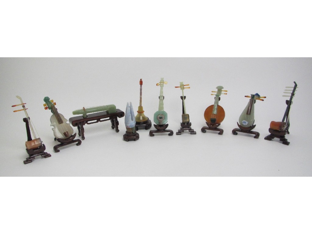 Appraisal: A set of Chinese jade instruments with wood stands and